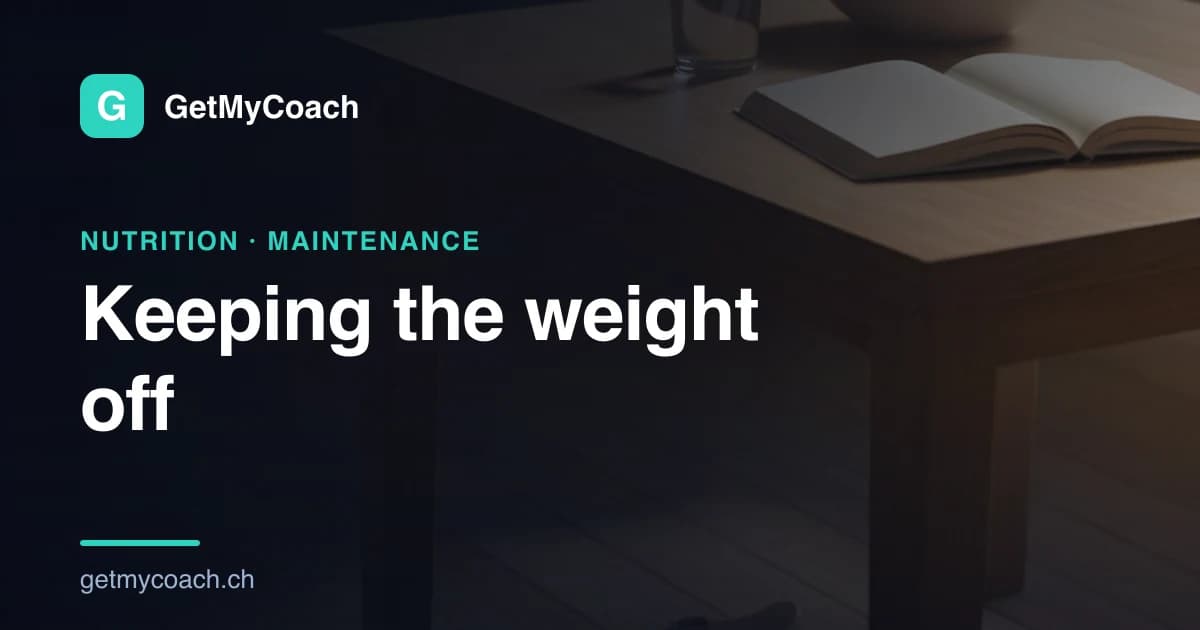 A quiet wooden kitchen table in dim morning light, an open notebook lying on it beside a glass of water and a plain bowl — cover image for the GetMyCoach guide to keeping weight off after a diet.