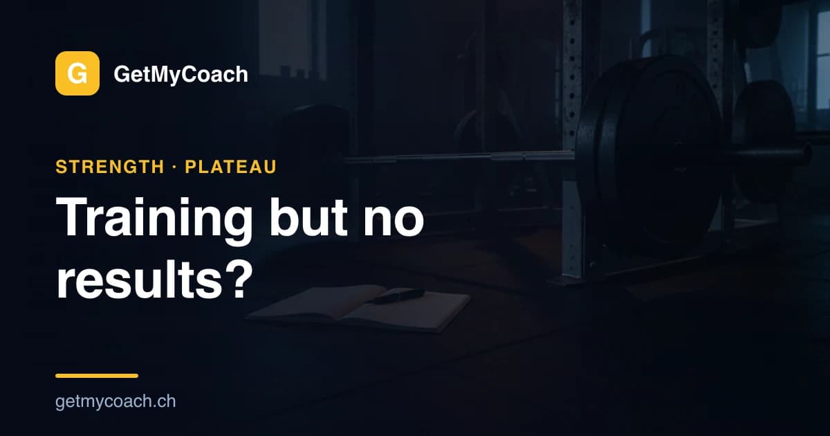 A loaded barbell resting in a squat rack in a quiet, dimly lit gym, an open paper training log lying on the floor beside it — cover image for the GetMyCoach guide to training without seeing results.