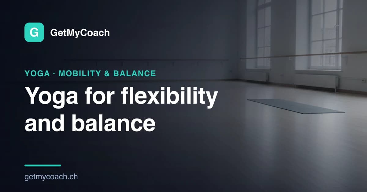 An empty light-filled studio floor of pale polished wood with tall windows down one side and a single mat unrolled in the distance — cover image for the GetMyCoach guide to yoga for flexibility and balance.
