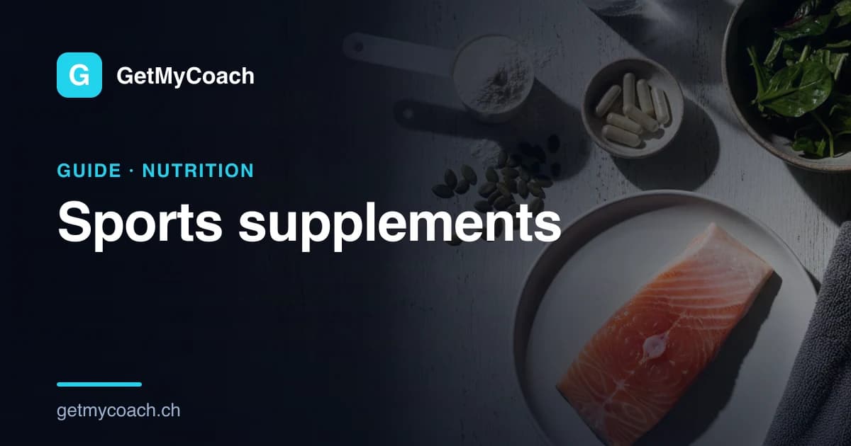 An overhead view of a dark table: a measuring scoop of white powder, a small dish of plain capsules, a scatter of pumpkin seeds, a raw salmon fillet on a plate and a bowl of leafy greens.